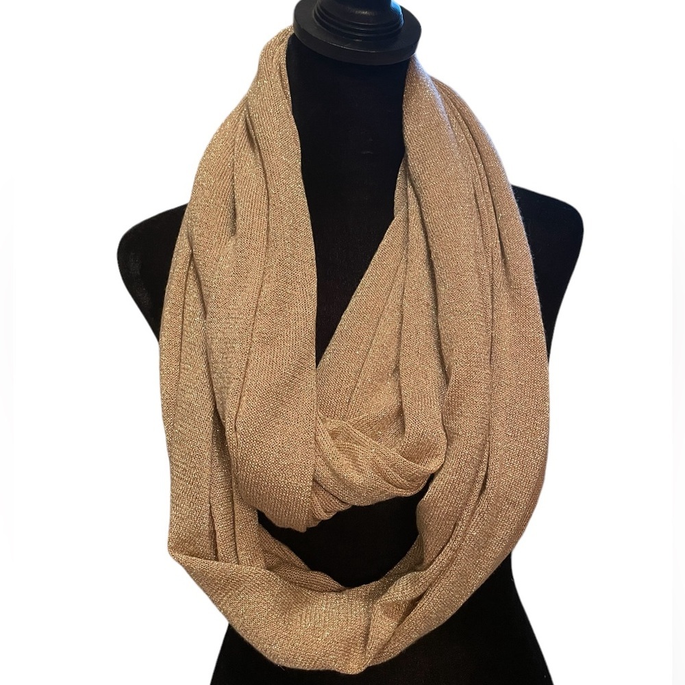 Pale‎ pink infinity scarf with gold threads.